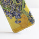 Vase With Irises Against A Yellow Background